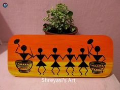 an orange and yellow painted wooden sign with people holding potted plants on it's sides