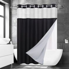 a black and white shower curtain in a bathroom