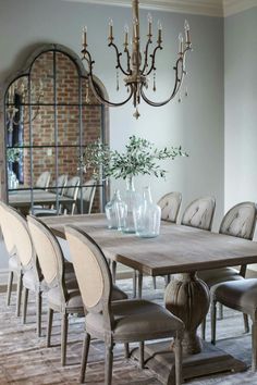 a dining room table with chairs around it