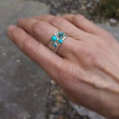 "Turquoise and silver stacking rings created from recycled silver and four different turquoise gemstones. For the largest stone you can choose to either have one with lovely matrix (first picture) or solid color (fifth picture). The others are different complimentary shades of solid blue. The rings coordinate beautifully giving you many options. Artfully simple if worn alone, they can be worn with other stacking rings for a pop of color. Also, available with oxidized finish (last 2 pictures). If Rings Turquoise, Silver Stacking Rings, Sleeping Beauty Turquoise, Turquoise Rings, Recycled Silver, Hammered Silver, Turquoise Gemstone, The Rings, Stackable Rings