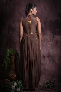 Brown in cut sleeves floor length flared gown embellished with multicolor sequin, bead work and thread embroidery on waist and cowl hem on one side.
Components: 1
Pattern: Embroidery
Type Of Work: Sequin, Beads
Neckline: Pleated collar
Sleeve Type: In cut sleeves
Fabric: Chinon, Lining: Cotton
Color: Brown
Other Details: 

Attached inner lining
Geometric and floral sequin embellishments
Length:
Gown(in inches): 59
Occasion: Cocktail, Reception - Aza Fashions Pleated Collar, Multicolor Sequins, Gown For Women, Cocktail Reception, Beaded Neckline, Pattern Embroidery, Thread Embroidery, Aza Fashion, Sleeve Type