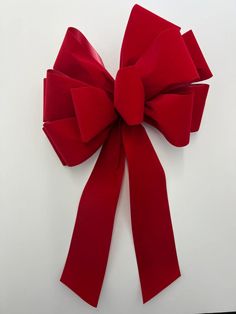 a large red bow on a white background