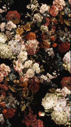 a bunch of flowers that are on the ground in front of a black background with red, white and blue flowers