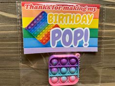 there is a plastic birthday pop box with balls in it and a sign that says, thanks for making my birthday pop