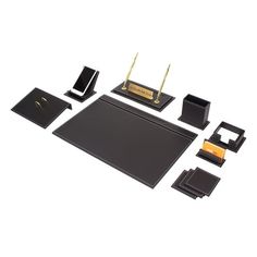 a black desk set with pen, phone and other items