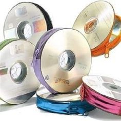 several different colored ribbons are stacked on top of each other in the shape of discs