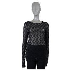 100% authentic Gucci GG embroidered sheer mesh top in black cotton (54%), polyamide (31%), polyester (9%) and elastane (6%). Features a round neck and long sleeves. Brand new. Measurements Tag Size M Size M Shoulder Width 41cm (16in) Bust From 92cm (35.9in) Waist From 86cm (33.5in) Hips From 90cm (35.1in) Length 72cm (28.1in) Side Seam Length 50cm (19.5in) Sleeve Length 77cm (30in) All our listings include only the listed item unless otherwise specified in the description above. Luxury Gucci Graphic Print Tops, Luxury Designer Gucci Blouse, Gucci Evening Long Sleeve Tops, Gucci Fitted Sleeveless Top, Gucci Fitted Shirt For Spring, Black Collared Gucci Top, Elegant Fitted Gucci Shirt, Gucci Shirt, Sheer Mesh Top