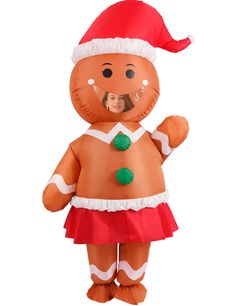 an inflatable gingery man wearing a santa hat and red dress with green buttons