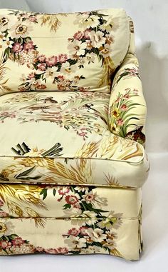 a floral print chair with matching foot rest