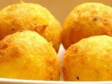 some fried food in a white bowl on a table