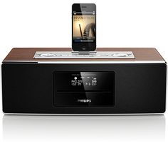 an iphone is sitting on top of a stereo