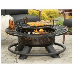 an outdoor fire pit sitting on top of a patio