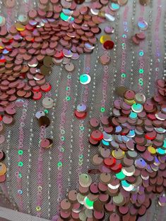 there are many different colored sequins on the fabric