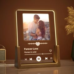 a wooden frame with an image of a man and woman in love on the screen