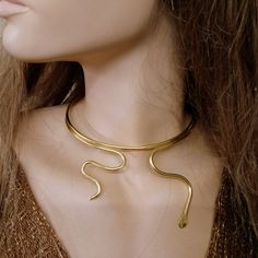 Snake Necklace, Snake Choker, Snake Jewelry, Gold Snake Necklace, Serpent Necklace, Brass gold plated, Sterling Silver 925,The14k Gold filled. Handmade minimal chic choker necklace made of Brass , Sterling silver 925. Brass gold plated,The14k Gold filled. -The Brass Gold Color. -Brass gold plated. -The Sterling Silver 925 . -The14k Gold filled . Each necklace is hand polished for a touch of sophistication. They are easy and simple to use and can be worn as a compliment to your existing gold or s Gold Plated Snake Shape Jewelry, Gold-plated Snake Shape Jewelry, Gold Plated Snake Chain Choker Gift, 14k Gold Choker Perfect As A Gift, Brass Snake Chain Jewelry For Gift, Brass Snake Chain Jewelry Gift, Gift Brass Snake Chain Jewelry, Gold Snake-shaped 14k Gold Necklace, Gold Snake Shape 14k Gold Necklace