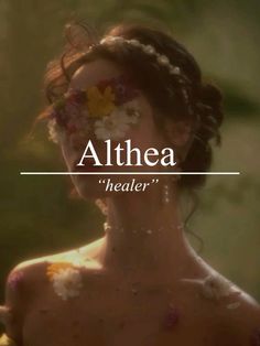 a woman with flowers in her hair and the words, althea healer