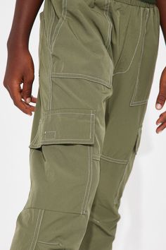 Available In Brown And Olive. Flare Pants Solid Stretch Nylon Side Pockets Cargo Snap Button Pockets Daddy & Me Takedown Of "Contrast Stitched Nylon Cargo Flared Pants" 88% Nylon 12% Spandex Imported | Mini Contrast Stitched Nylon Cargo Flared Pants in Olive Green size 8 by Fashion Nova Search By Photo, Olive Fashion, Flared Pants, Matching Dresses, Contrast Stitch, Flare Pants, Snap Button, Clothes For Sale, Dresses For Sale