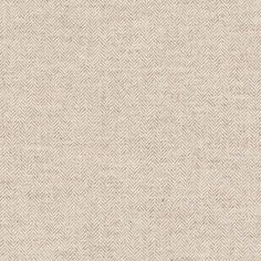 an upholstered beige fabric textured with herringbones