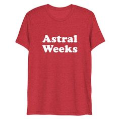 a red t - shirt with the words astral weeks printed in white on it