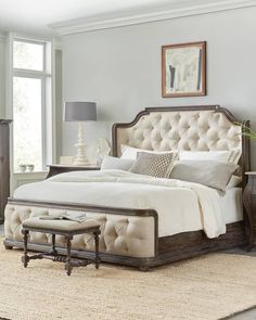 a bedroom with a bed, dresser and chair in it's centerpieces