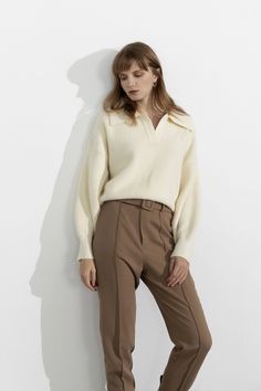 1.Product Details Clean, chic, casual—the three c's for an effortless look. An ivory collared sweater featuring long sleeves and a cropped fit. Pair over minimalist trousers or jeans for a simple yet sophisticated look. Fit Type: Regular Fit How it Fits: Four-way Stretch Fabric: 48%Acrylic 12%Polyamide 4%Spandex 36%Polyester Care Instructions: 1.Hand Wash 2.Do not bleach 3.Dry flat in shade 4.Iron cool (max 110â„? 5.Dry clean, tetrachloroethylene(PCE) only Please note: The images represent actual product though color of the image and product may slightly differ. 2.How To Measure It Model is wearing:S SKU: 2002M0002BGS/MSKU: ${data.sku} Classic Cropped Bottoms For Fall, Chic Beige Polo Sweater For Winter, Beige Long Sleeve Polo Sweater For Work, Chic Beige Polo Sweater For Work, Chic Collared Fall Sweater, Chic Collared Sweater For Fall, Oversized Long Sleeve Polo Sweater For Work, White Collared Sweater For Fall, Chic White Polo Sweater For Fall