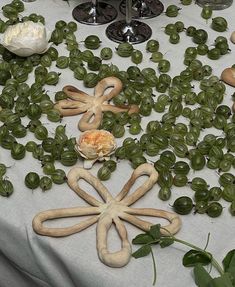 an assortment of food items on a table with flowers and candles in the background at a wedding reception