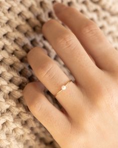 Our Pearl Ring is stunningly simple, and a staple piece for any wardrobe. This gold filled band ring features one of our pearls on an understated setting that completes the look. The Pearl Ring will live happily in your collection forever. Details: -Gold Filled -Size: 6, 7, 8, -Waterproof, Tarnish Free, Hypoallergenic Simple Dainty Rings, Dainty Pearl Ring, Simple Pearl Ring, Pearl Promise Rings, Pearl Ring Simple, Pearl Ring Gold, June Birthstone Ring, Ring Pearl, Gold Pearl Ring