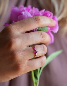 A beautiful modern and unique intense pink tourmaline, ruby and diamond ring makes a unique gift for anniversary or can be also alternative engagement ring. The design can be made with gemstones of your choosing. Other color variations are possible. If you would prefer a custom ring, please contact us before purchase. ★Details Main gemstone: rare intense purple pink tourmaline Shape: square, princess cut Measurements: approx. 5mm Side stones: white diamonds 1 x 2mm, 1x 1.6mm, VS, G color pink an Engagement Ring Pink, Pink Engagement, Moonstone Engagement Ring Set, Pink Engagement Ring, Pink Tourmaline Ring, Moonstone Engagement Ring, Cluster Engagement Ring, Custom Ring, Alternative Engagement Rings