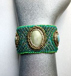 a close up of a bracelet on a mannequin headdress with beads