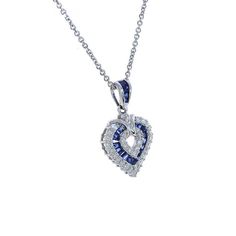 "This marvelous open heart shaped gemstone pendant necklace showcases baguette cut sapphires set in a channel setting & crafted in 14k white gold.The contemporary heart shaped pendant features bright round cut diamonds 0.50 c.t.w., color/clarity G,H-SI alternating with baguette cut sapphires 0.50 c.t.w. Enjoy a matching 14k white gold 18\" long chain with your purchase. Chain secures with lobster claw clasp. Necklace weight is 5.6 grams. For more information, contact Avital & Co Jewelry Heart-shaped Sapphire Jewelry For Formal Occasions, Sapphire Heart Pendant Jewelry For Anniversary, Formal Heart-shaped Sapphire Jewelry, Sapphire Heart Cut Jewelry With Brilliant Cut, Anniversary Sapphire Jewelry With Heart Charm, Fine Jewelry Sapphire Heart Pendant, Formal Sapphire Heart Pendant Jewelry, Heart-shaped Sapphire Jewelry For Anniversary, Heart Cut Sapphire Jewelry For Valentine's Day