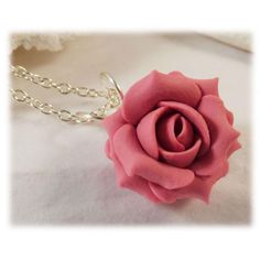 Handcrafted pink rose necklace available in colors. This pink flower necklace is offered in colors of mauve, violet, fuchsia, blush, dusty pink and more. This little simple adoring pink rose pendant is great for bridesmaid jewelry with a  pink wedding theme. Petite style rose pendant drops from a hand wired bail and from a cable chain. Other matching accessories available. -Original hand sculpted polymer clay flowers -Durable, water-resistant -No molds, no paint, no glue -Flower Size : Petite 1.5cm -Chain Length : Choose 16 or 18 inch -Components : Silver-plated, Gold-plated, Antique Brass, 925 sterling Silver or 14k Gold Filled Pictured : Vintage Pink View matching: Pink Rose Stud Earrings : https://www.etsy.com/listing/61621096 Pink Rose Drop Earrings : https://www.etsy.com/listing/61685 Pink View, Pink Flower Necklace, Rose Pendant Necklace, Pink Wedding Theme, Rose Stud Earrings, Gold Bond, Petite Style, Rose Pendant, Rose Necklace