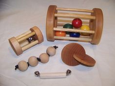 an assortment of wooden toys on a white sheet