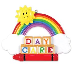 an ornament that says day care with a rainbow and clouds in the background