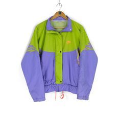 Welcome to our shop. We are waiting for your wishes, also don't be afraid to ask any questions. If you like something from our clothes, just add  to favourites or write to us. Follow us on instagram - @cashalot.store  - ITEM -  80s 90s rare Vintage men's NIKE multicolor green purple track jacket Size M retro sportswear rave style made in Thailand - SIZE - Size Label (M)  Pit - to - Pit - 25,6 (65cm) Sleeve from neck - 30,3 (77cm) Length - 25,2 (64cm) (all our items are measured laying flat) - CONDITION -  Total condition 8/10 Please check all Photos , also i can make detailed photos All needed questions ask before buying! - DELIVERY INFO - * All the parcels have a tracking number * All the items will be shipped after successful payment transaction within 1-3 business days. * International Vintage Purple Windbreaker For Streetwear, 90s Style Green Track Jacket For Sports, Multicolor Track Jacket For Streetwear, Retro Purple Windbreaker For Streetwear, Green Track Jacket For Streetwear Athleisure, Sporty Purple Track Jacket For Streetwear, 90s Green Sports Windbreaker, 90s Multicolor Track Jacket For Streetwear, 90s Green Sports Outerwear