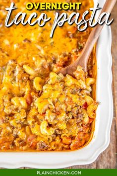 a casserole dish filled with taco pasta and topped with tortilla shells