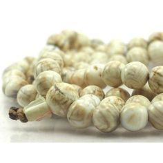 Arca Shell 108 Bead Mala Bead Size 10mm Strand Approx. 37" Strung on cotton cord Origin is Nepal Artisan White Single Strand Beads, Hand-strung White Mala With Round Beads, White Hand-strung Mala With Round Beads, 108 Mala Beads, 108 Bead, Mala Beads, Cotton Cord, Nepal, Shells