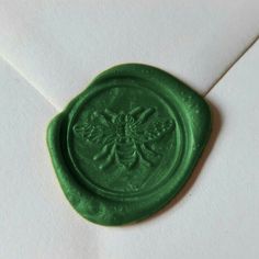 a wax stamp on top of an envelope