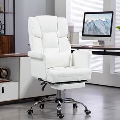 a white office chair sitting in front of a computer monitor on top of a desk