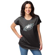 the philadelphia eagles women's black team logo t - shirt is shown with her hands on her hips