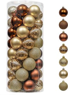 an assortment of christmas ornaments in a clear container with gold and silver baubles