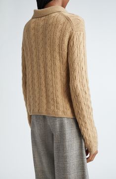 Classic cables in a luxurious wool and cashmere blend refine a polo-sweater that brings sporty energy to any look. 20" length (size Medium) Button half placket Spread collar Long sleeves Ribbed cuffs and hem 67% wool, 27% cashmere, 5% nylon, 1% spandex Hand wash, dry flat Imported Long Sleeve Merino Wool Cable Knit Polo Sweater, Wool Cable Knit Long Sleeve Polo Sweater, Long Sleeve Wool Cable Knit Polo Sweater, Luxury Merino Wool Sweater For Fall, Classic Cable Knit Polo Sweater, Fall Merino Wool Cable Knit Polo Sweater, Designer Cashmere Fine Knit Sweater, Wool Cable Knit Polo Sweater For Fall, Classic Fall Cable Knit Polo Sweater