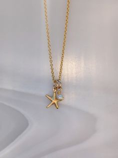 "Starfish Necklace with a Pearl/shell charm. Please note the pendant is small and lightweight, see sizes below.  - Made From: Gold Fill - Gemstone: Pearl - made from the inside of a pearl shell, so not a freshwater pearl nor mother of pearl but made from the shell itself  - Pendant Size: starfish - 1Omm. Pearl - 2mm - Chain Length: 16\", 18\" or 20\" As they are handmade please note pieces will never have the same finish as machine made/mass produced.  Each one is unique. What is Gold Fill  - Gold Filled Jewellery is a thick layer of Real solid 14k Gold over a base Metal of sterling silver or brass. It is Not the same as Gold Plate. - Gold Fill will never tarnish and will never reveal the base layer - it is hypoallergenic  - if looked after well Gold Fill jewellery pieces can last a life t Summer Pendant, Summer Board, Starfish Pendant, Starfish Necklace, Jewelry Accessories Ideas, Pearl Shell, Gold Filled Jewelry, Gold Pendant Necklace, Pretty Jewellery