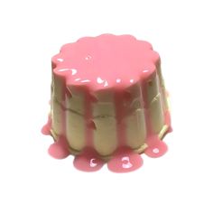 a small cake with pink icing on it