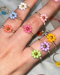 Colorful flower adjustable rings, Gold plated wire adjustable rings, Floral ring  They are adjustable so that you can wear them comfortably on any of your fingers. Are made with Czech beads, gold plated wire Adjustable Gold Flower Ring, Adjustable Flower Decorated Jewelry For Spring, Adjustable Flower Ring For Summer, Trendy Adjustable Rings For Spring, Gold Open Ring Flower Ring For Spring, Gold Open Flower Ring For Spring, Trendy Adjustable Spring Rings, Handmade Adjustable Flower Ring, Adjustable Multicolor Flower Ring