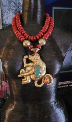 Tibetan Brass Repousse Monkey Pendant with Inlaid Turquoise & Coral measures 6" x 4.5". This is very rare since it is done in a warm metal; most are done in cool tones. Non-adjustable 19" in length - comprised of Nepalese Vintage Red Glass Sherpa Beads which are rustic looking (collectors prefer these). Two huge brass beads flank the pendant. Finished with four large, fancy ornate ethnic beads. Closes with gold tone hardware and a lobster claw clasp. If requested, I can add an extender chain fre Artisan Turquoise Necklace For Festivals, Artisan Turquoise Necklace In Gold For Festival, Artisan Gold Turquoise Necklace For Festival, Traditional Hand-strung Turquoise Necklace For Festival, Traditional Gold Beaded Turquoise Necklace, Rocker Chic Accessories, Tibetan Necklace, Unique Pendant Necklace, Statement Bib Necklace