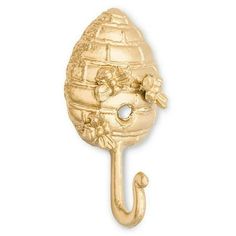 a gold colored metal hook with an umbrella shaped like a ball on it's side