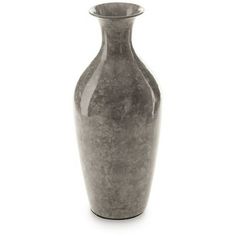 a gray vase sitting on top of a white table