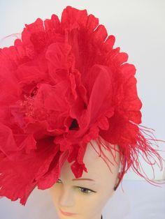 "* This 14\" diameter vibrant red open flower with red netting is spectacular and eye catching. * In between many of the individually wired petals are bunches of soft red tulle netting which gives a sophisticated edge. * From all sides this is a well designed and from the sides and back you can see the red Ostrich feathering. * Upon ordering you will receive this exact fascinator. * Designed on a satin covered acrylic headband it is well balanced, comfortable to wear and will fit just about any Acrylic Headband, Ladies Luncheon, Open Flower, Flower Headpiece, Soft Red, Special Dinner, Easter Rabbit, Costume Hats, Black Feathers