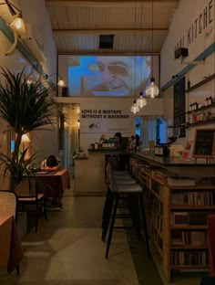 the inside of a restaurant with tables and chairs