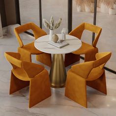 a round table with four chairs around it in a room that has marble floors and large windows